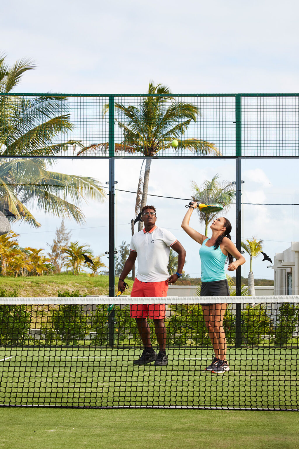 woman and man playing tennis