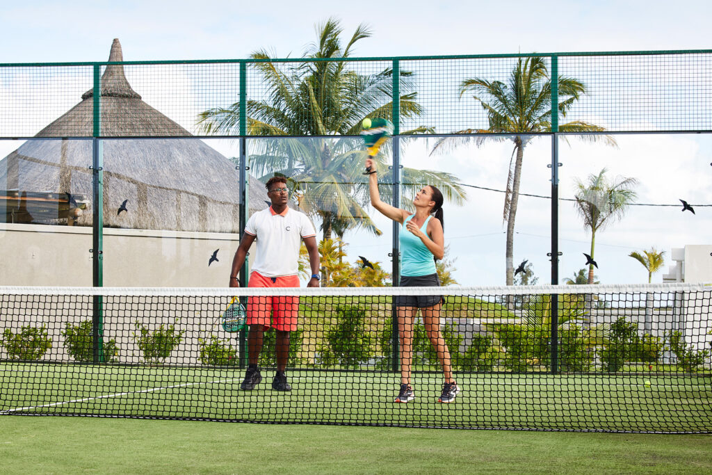 woman and man playing tennis