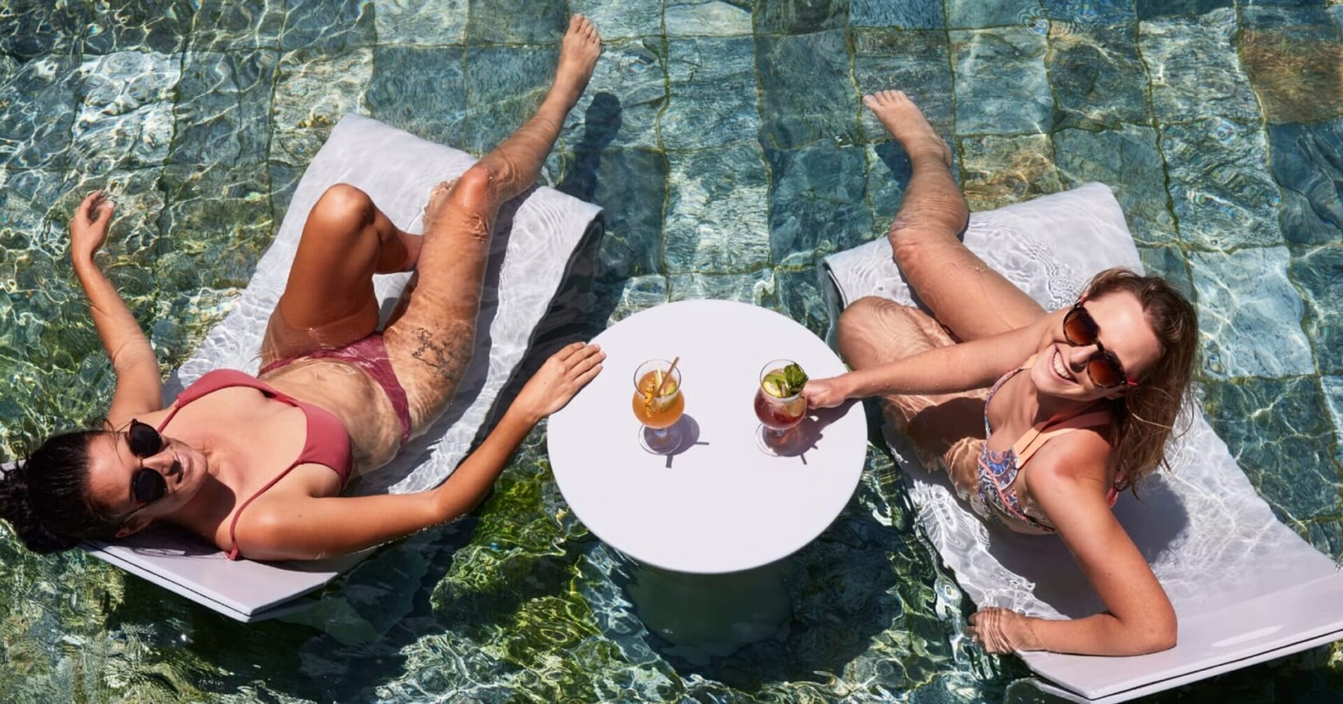 ladies resting in the pool